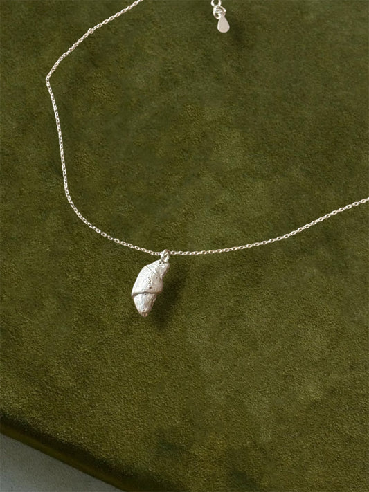 Handcrafted croissant pendant